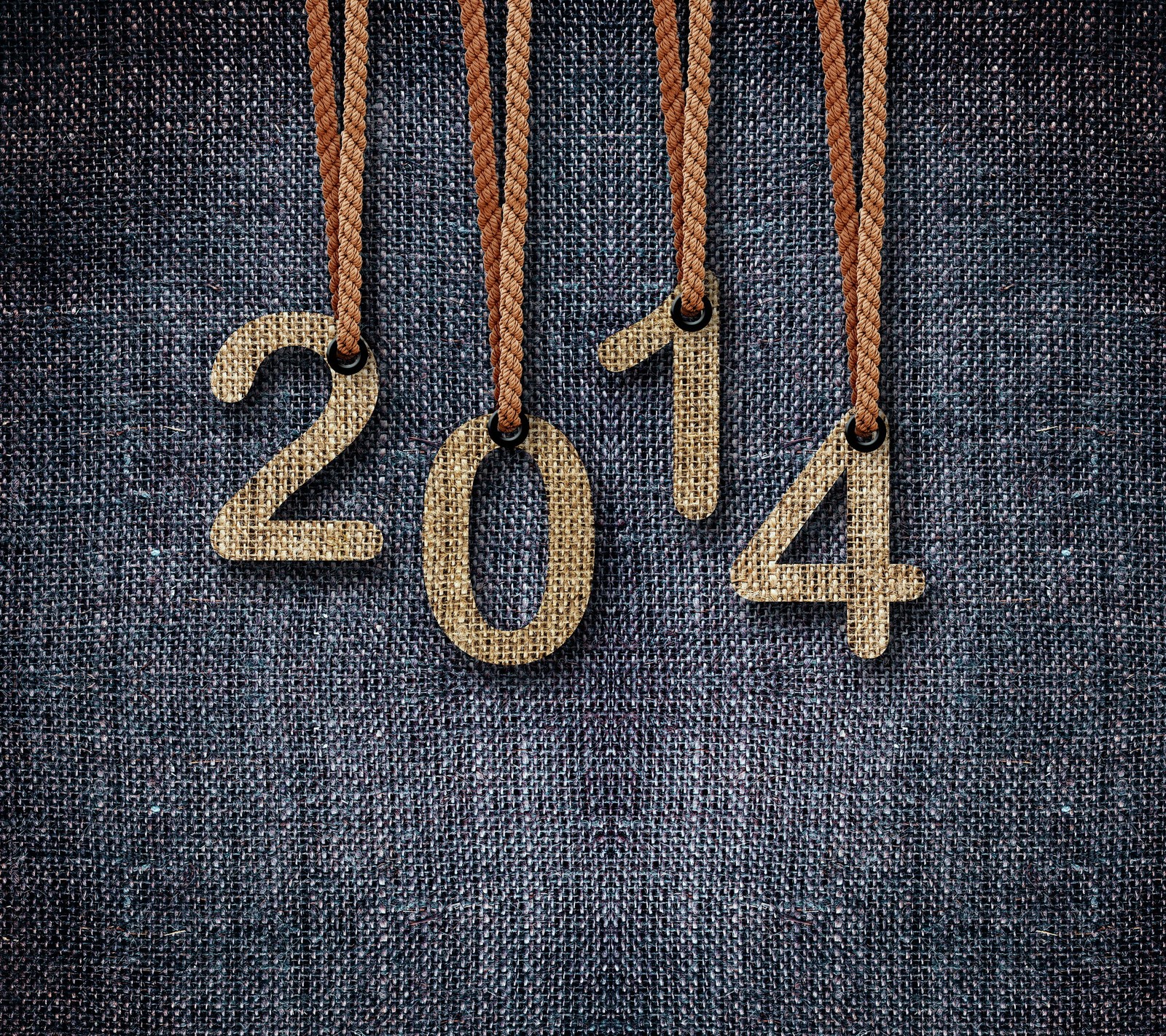 A close up of a pair of jeans with numbers 2014 hanging from them (2014, happy, jeans, new year)