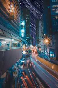 Dynamic Cityscape: Illuminated Skyscrapers and Flowing Automotive Light Trails