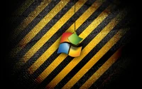 Macro Photography of a Windows Logo on Yellow and Black Striped Background