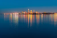 Illuminated Cityscape Reflections at Dusk