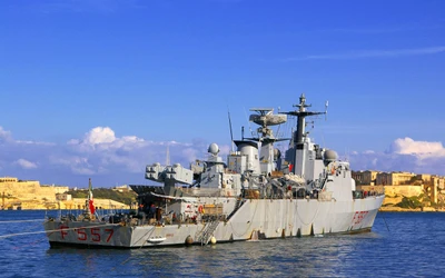 Guided Missile Destroyer F557 Docked Against a Scenic Coastal Backdrop