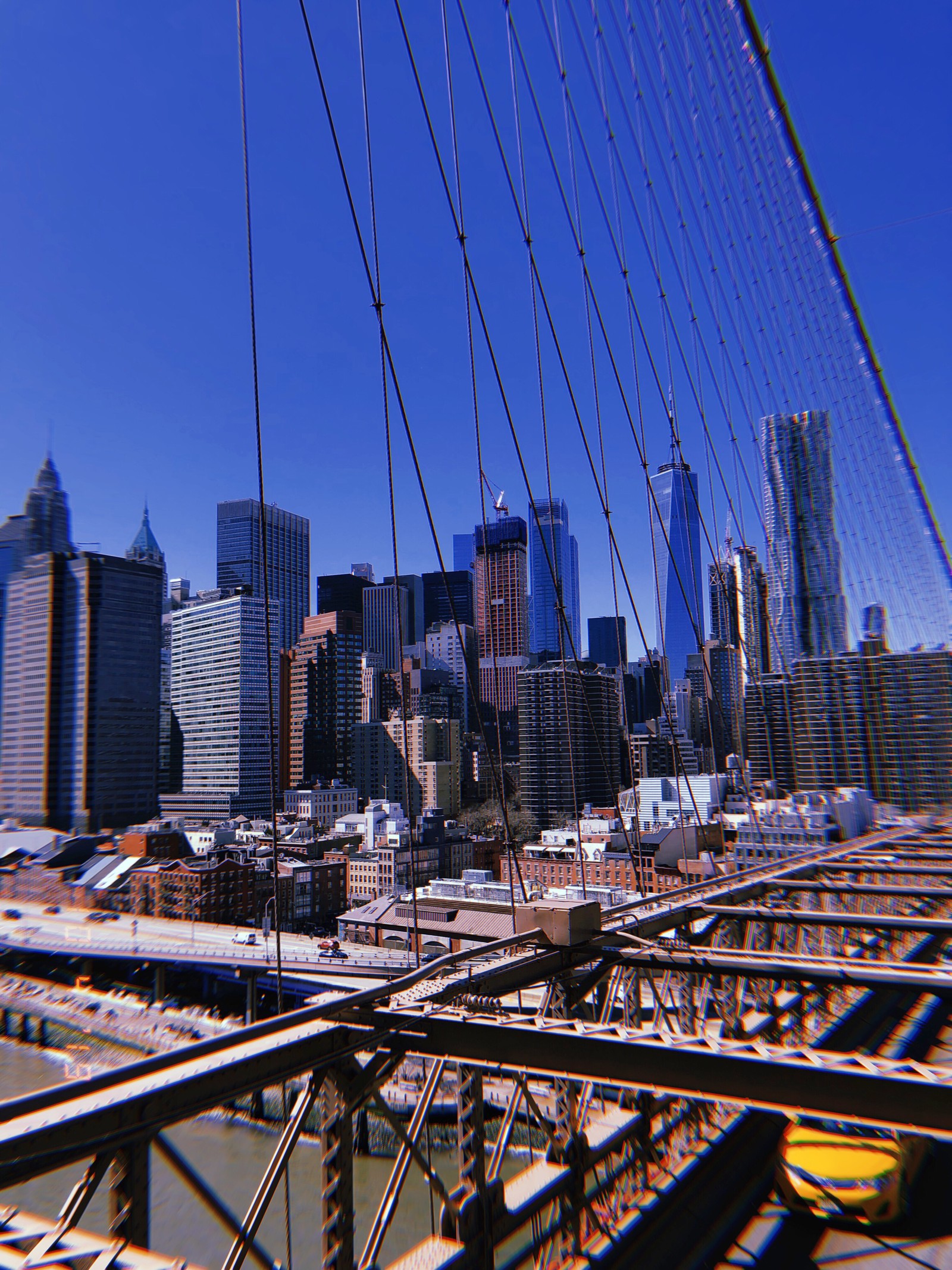 Arafficial view of a city from a bridge with a view of the city (new york city, usa, new york, skyscraper, daytime)