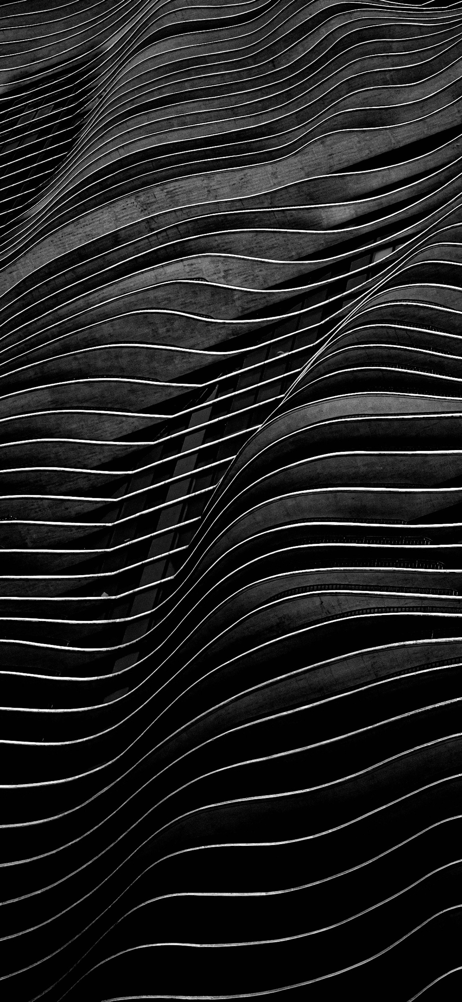 A close up of a black and white photo of a wavy surface (black and white, monochrome, natural material, pattern, electric blue)