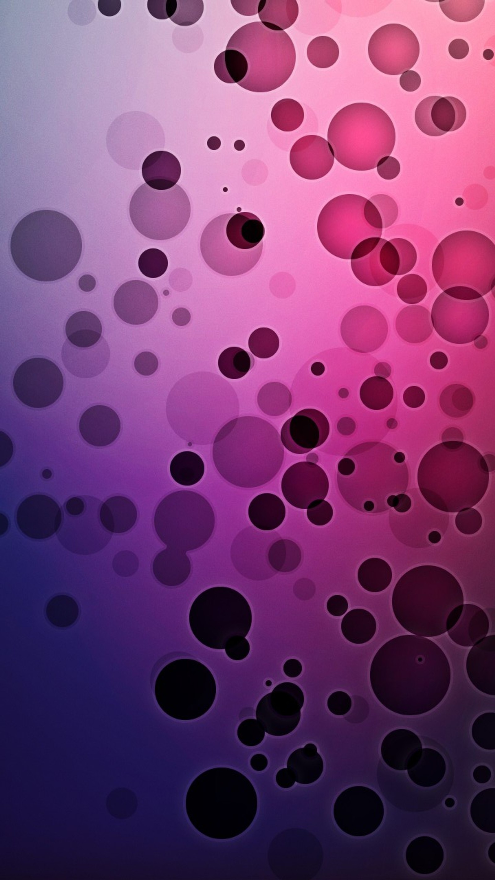 A close up of a cell phone with a bunch of bubbles on it (abstract, dots, purple)