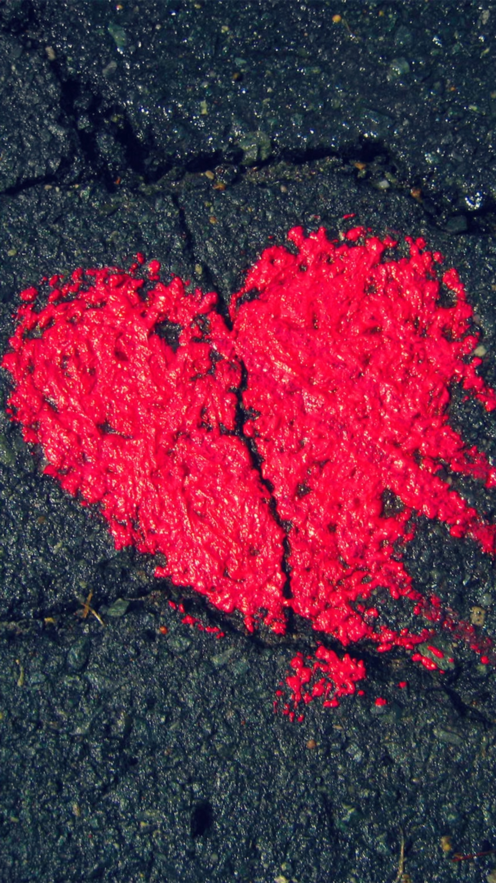 Arafed red heart on the ground with a crack in it (heart, shape)