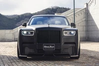 Sleek Black Rolls Royce Supercar with Distinctive Front Grille