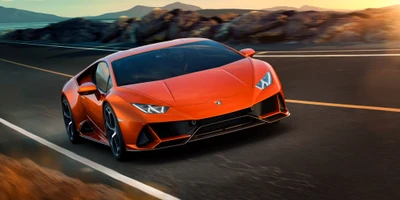 Lamborghini Aventador orange filant le long d'une route côtière pittoresque.