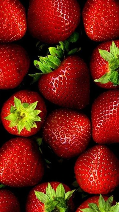 Vibrant Red Strawberries on Dark Background