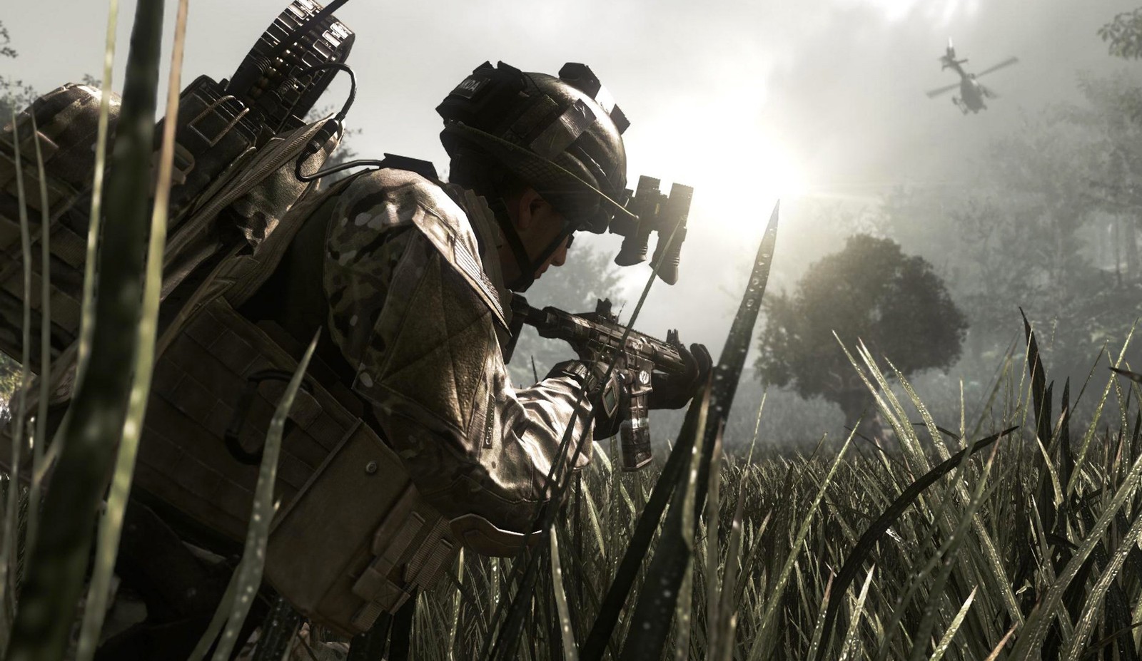 A man in camouflage holding a rifle in a field of tall grass (call of duty ghosts, activision, playstation 4, playstation 3, soldier)