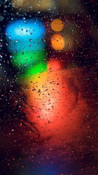 Colorful Rain-Drenched Portrait with Vibrant Bokeh