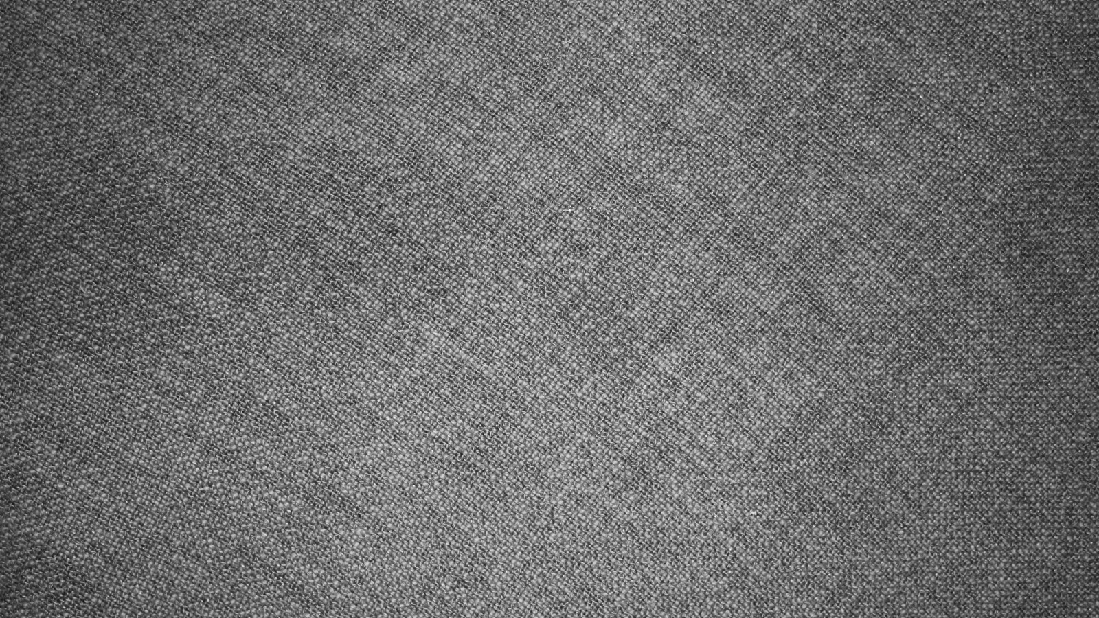 A close up of a black and white photo of a piece of fabric (textile, grey, texture, black, pattern)