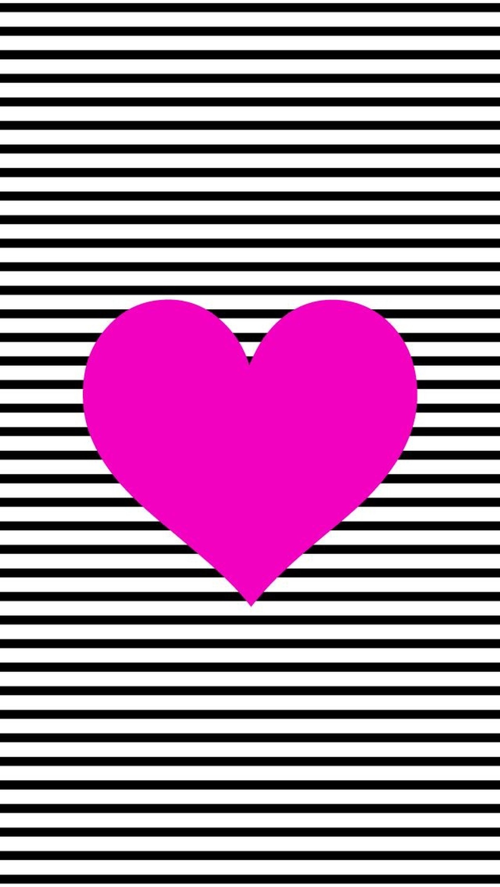 A pink heart on a black and white striped background (heart, pink)