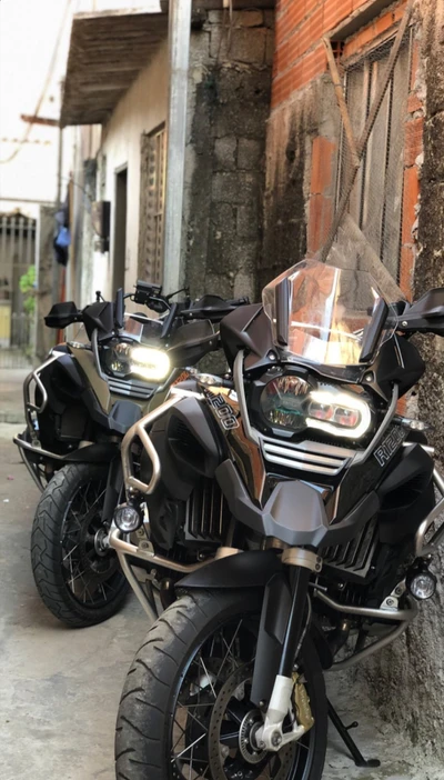 Two BMW Beco Motorcycles Parked in a Narrow Alley