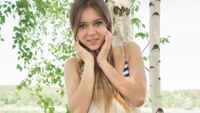 Radiant Beauty with Long Brown Hair Embracing Nature