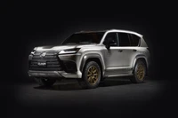 Lexus LX 600 Off-Road in Sleek Silver with Gold Accents against a Dark Background