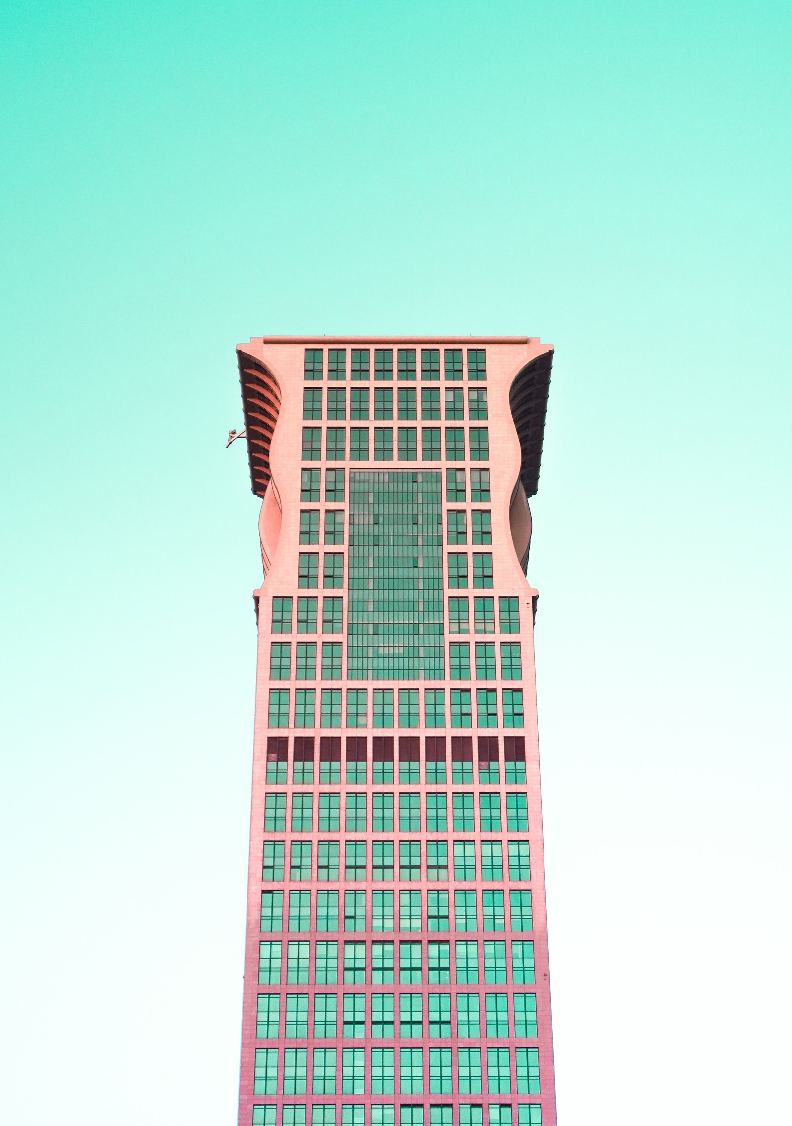 Arafed view of a tall building with a clock on the top (building, architecture, skyscraper, tower, turquoise)