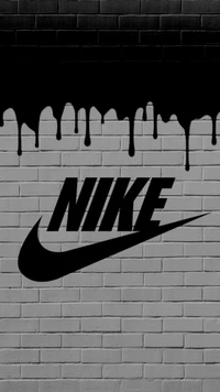 Граффити логотипа Nike на кирпичной стене с черной капающей слизью