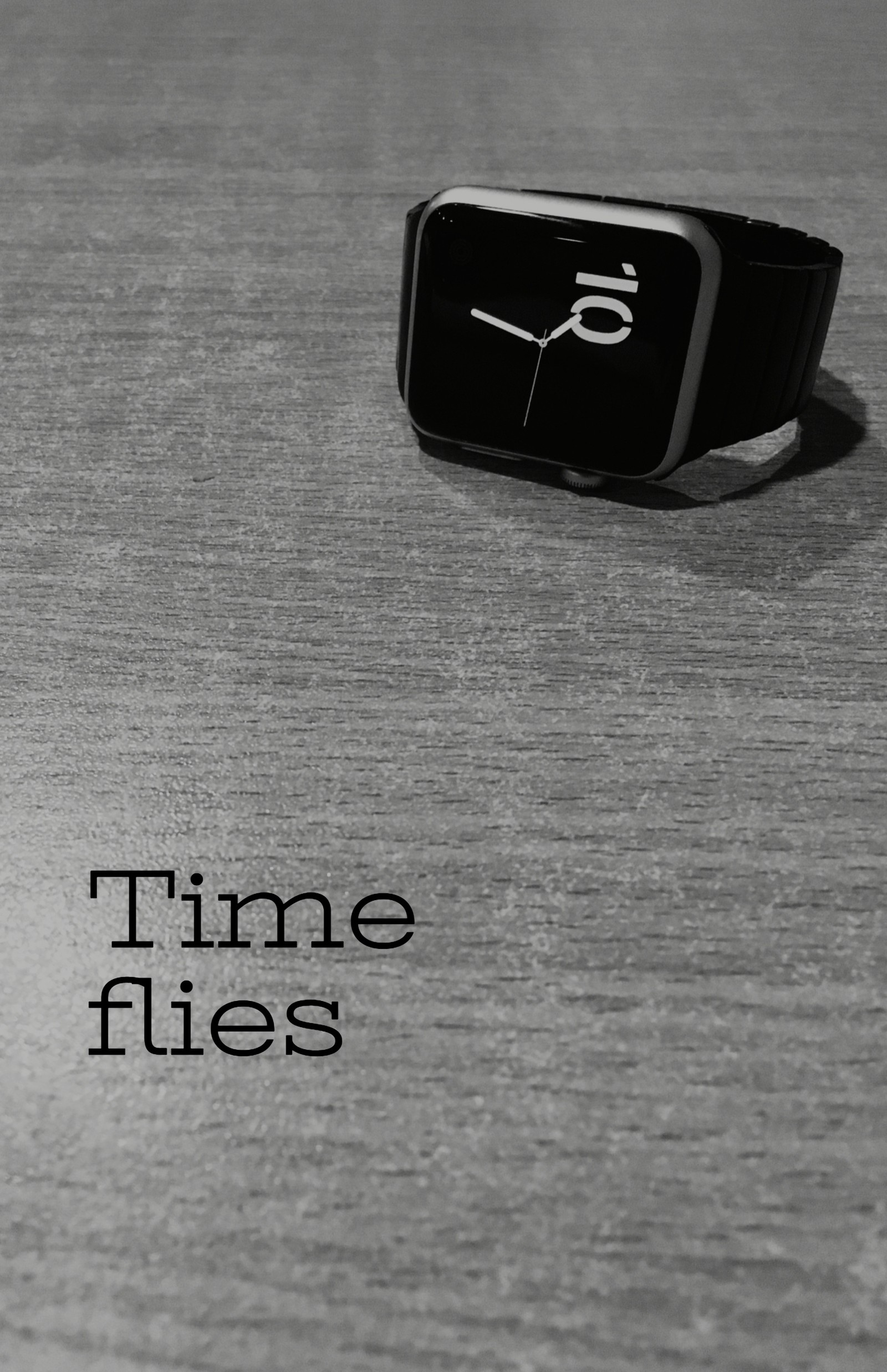 There is a black and white photo of a watch on a table (black, luxury, themes, watches, white)