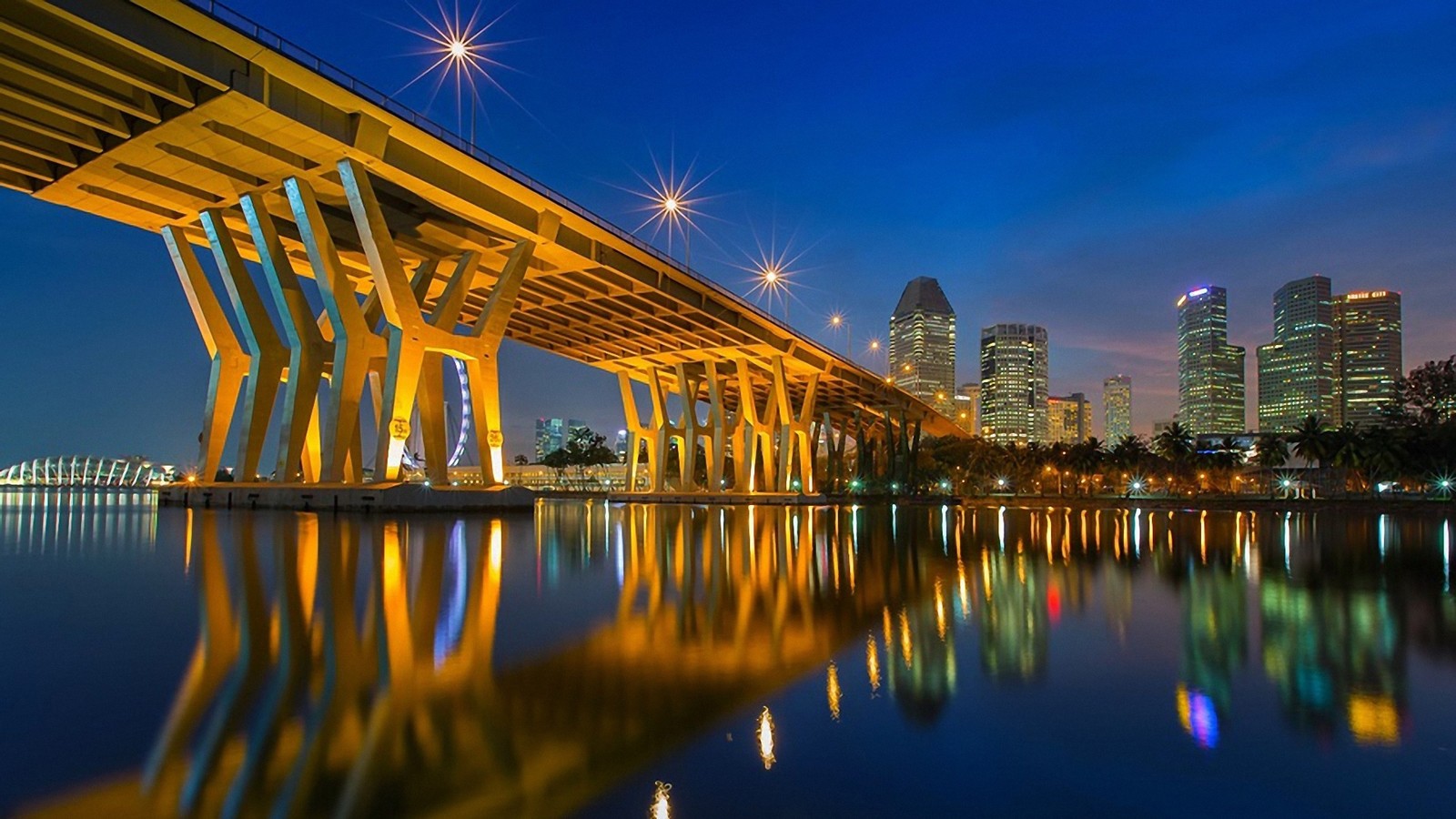 Vue arabe d'un pont sur un plan d'eau avec une ville en arrière-plan (réflexion, eau, nature, pont, point de repère)