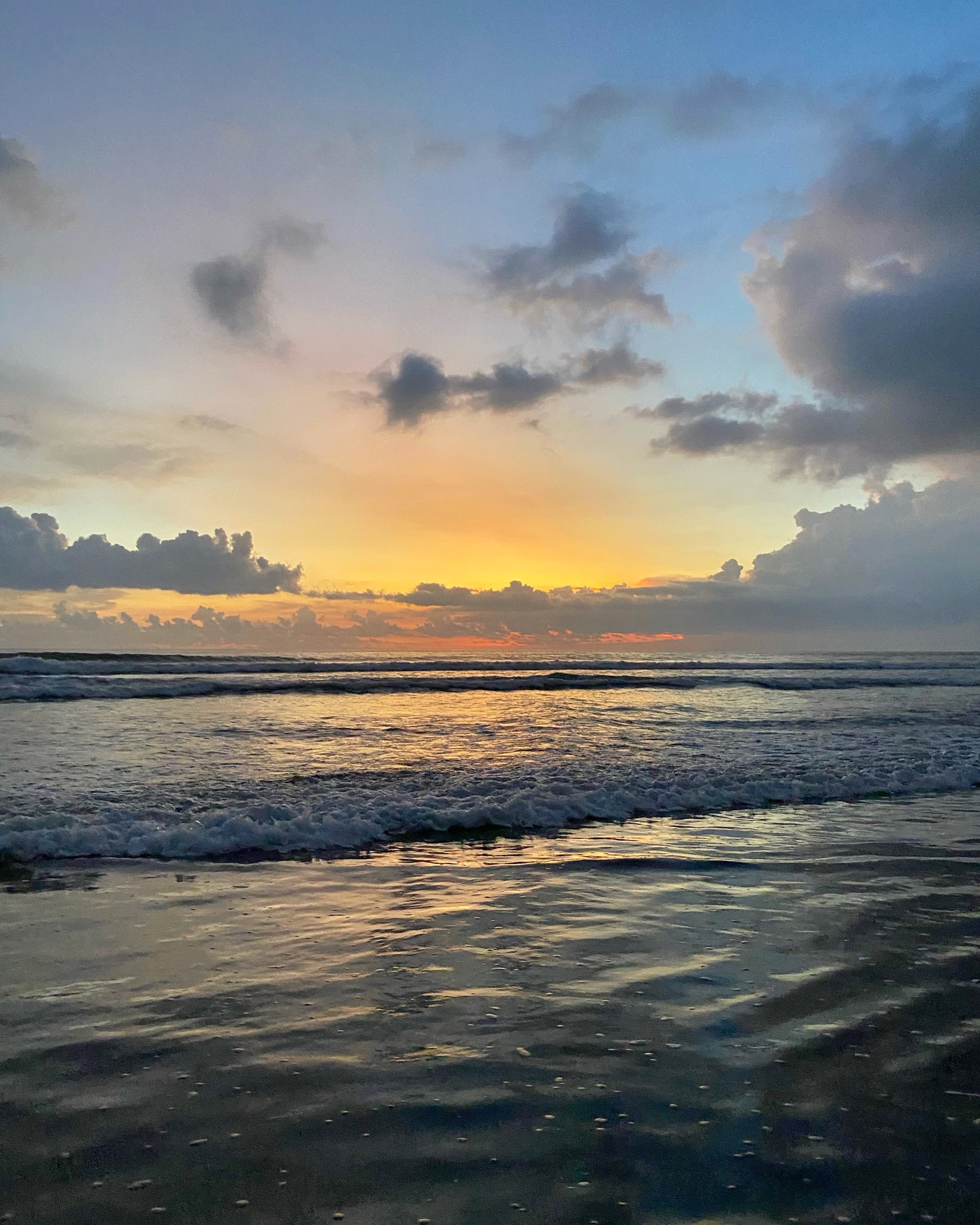 Araffes are walking on the beach at sunset with a surfboard (sea, villa, vacation, house, fluid)