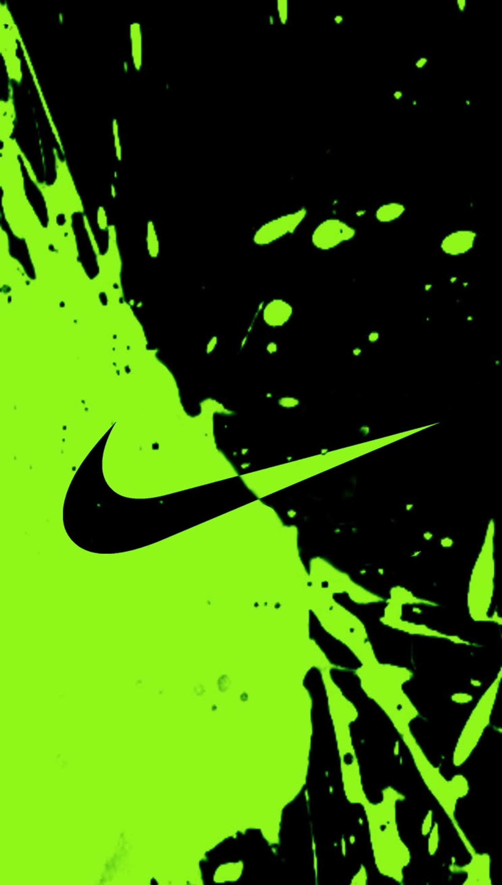 A close up of a green and black background with a nike logo (black, brand, green, logo, nike)