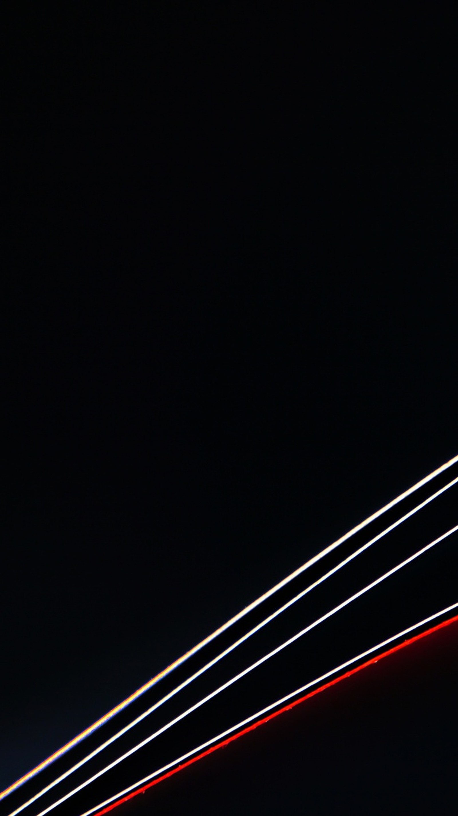 Arafed view of a plane flying through the night sky (black, color, lines)