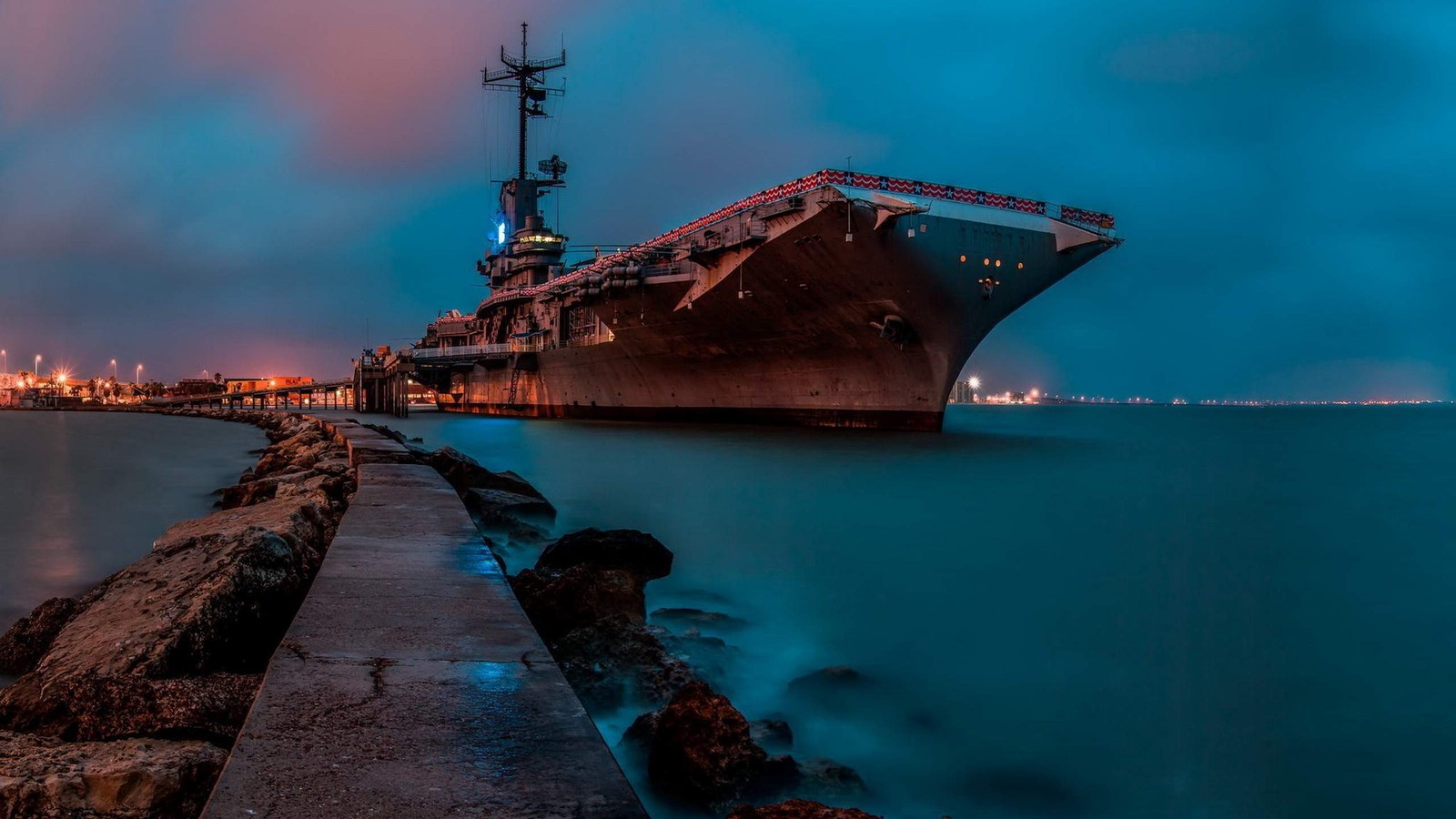 A close up of a large ship on a body of water (aircraft carrier, united states navy, blue, ship, battleship)