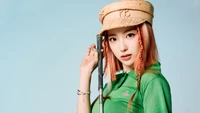 Riina from 하이키: Striking Pose in Green Golf Attire