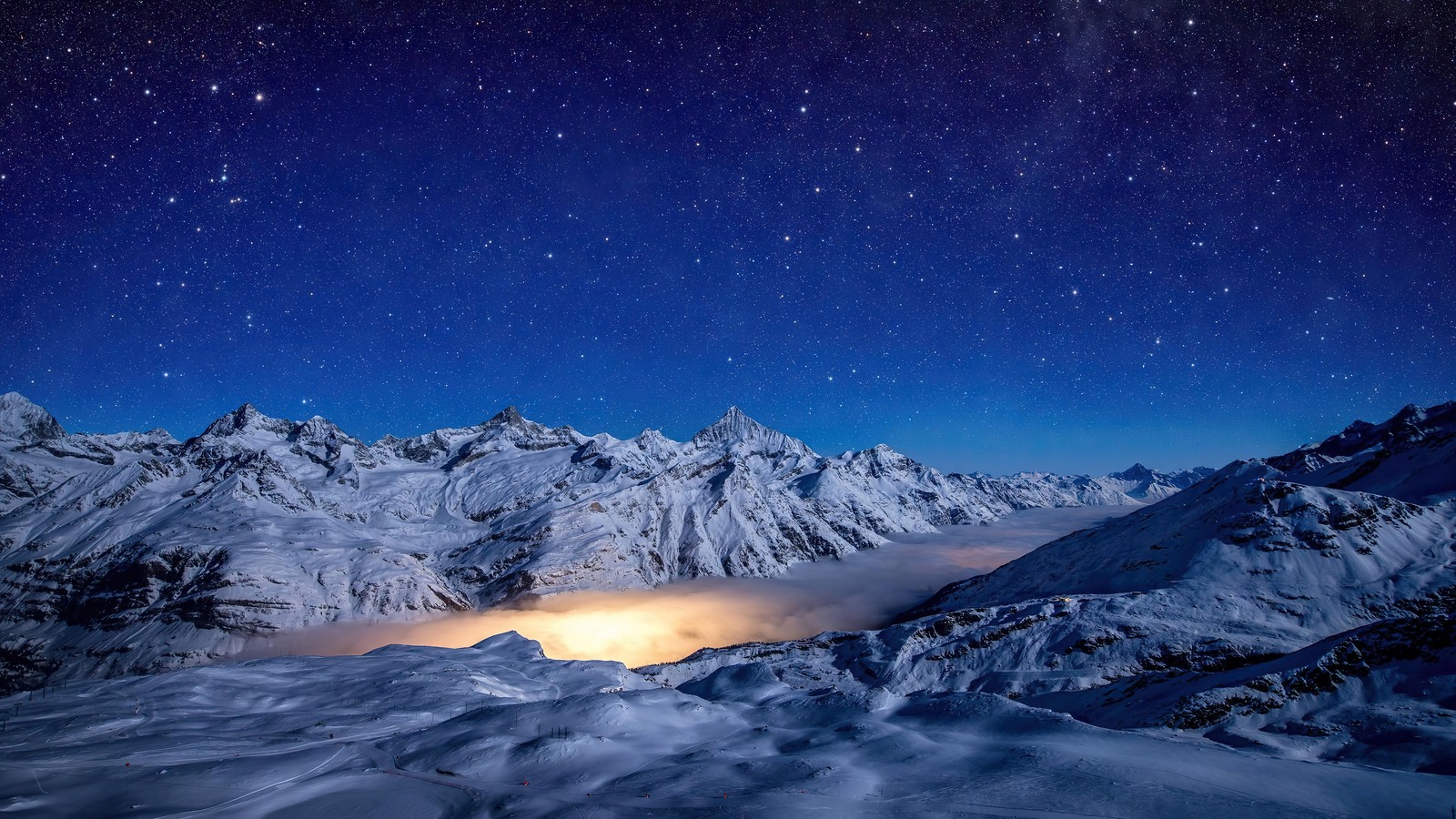 A view of a mountain range with a sky full of stars (night, snow, mountain, sky, stars)