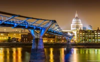 Illuminated Millennium Bridge Reflecting St. Paul's Cathedral at Night