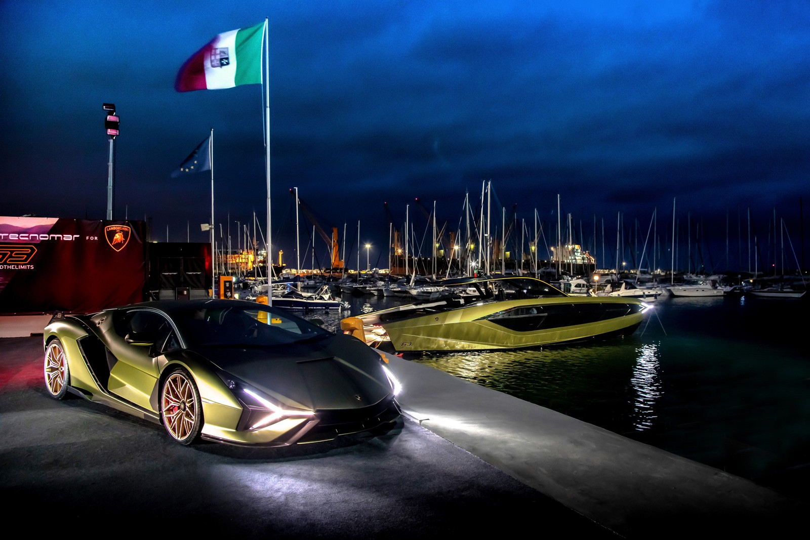 Um lamborghini alugado estacionado em frente a uma marina à noite (lamborghini sián fkp 37, tecnomar para lamborghini 63, superyate, iate a motor, iate de luxo)