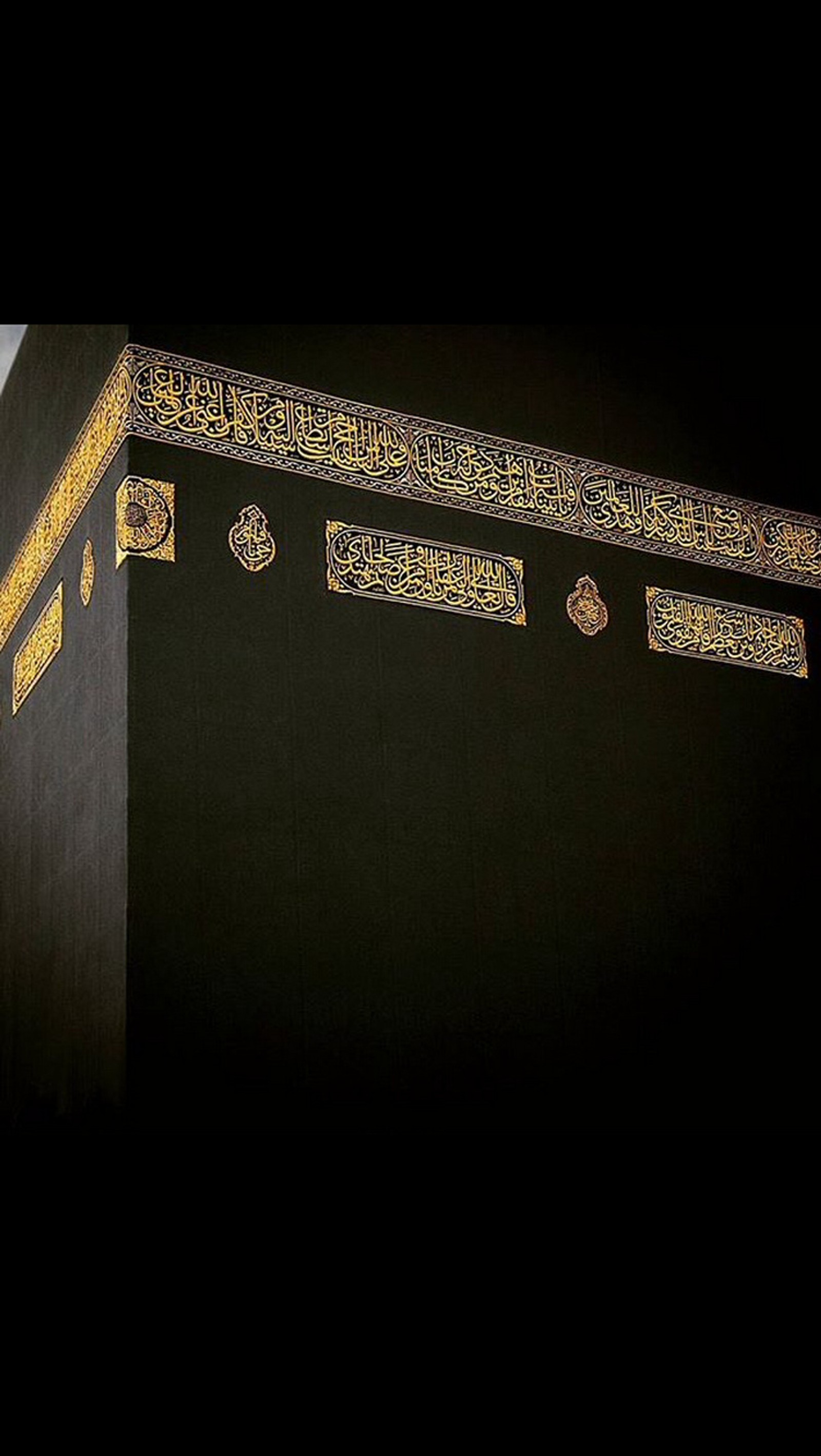 Arafed view of a black and gold building with a clock (holly, kabah)