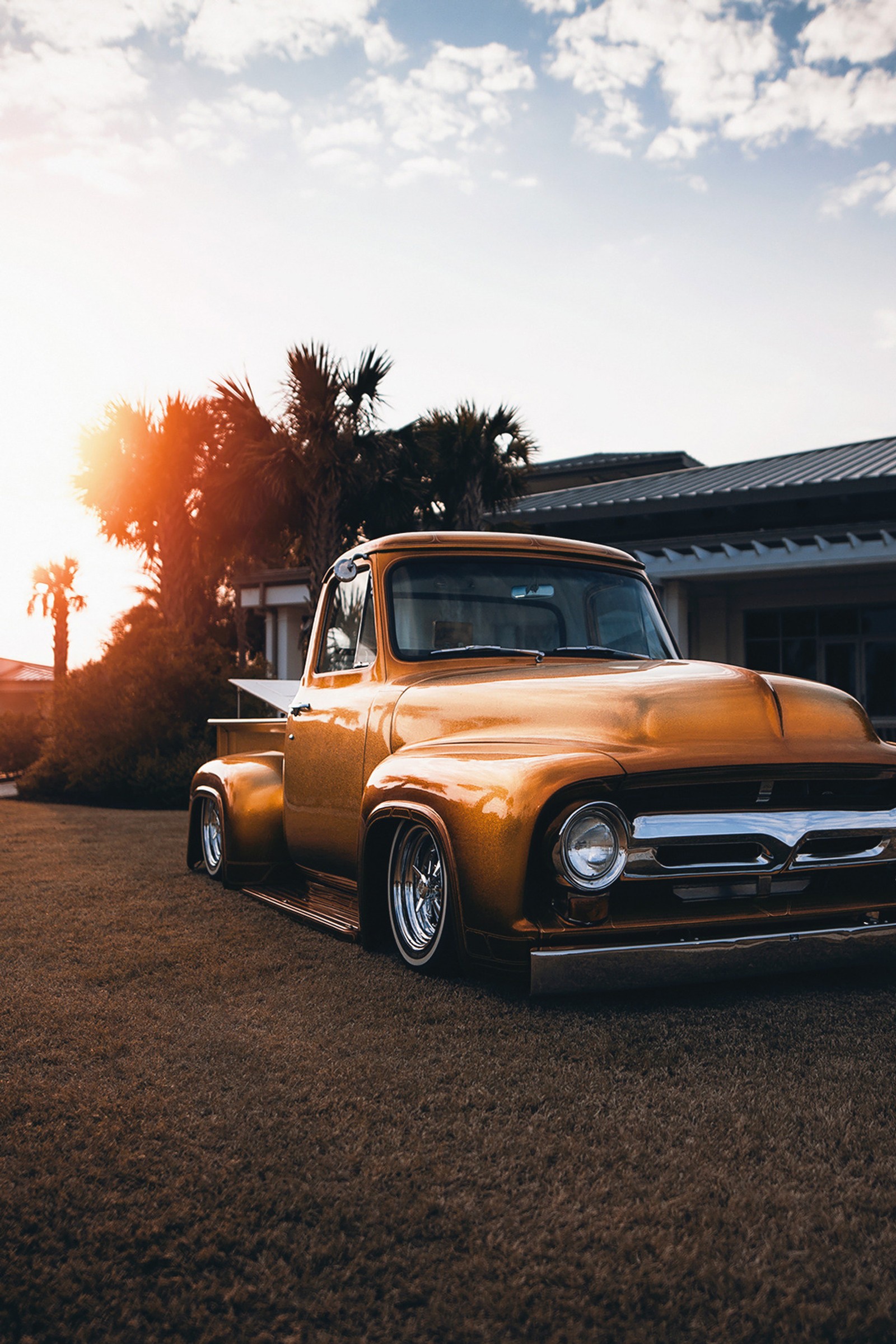 There is a yellow truck parked in a parking lot (car, cars, challenger, classic, dodge)