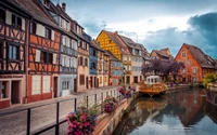 Charming Little Venice: Colorful Half-Timbered Houses Along a Serene Canal.