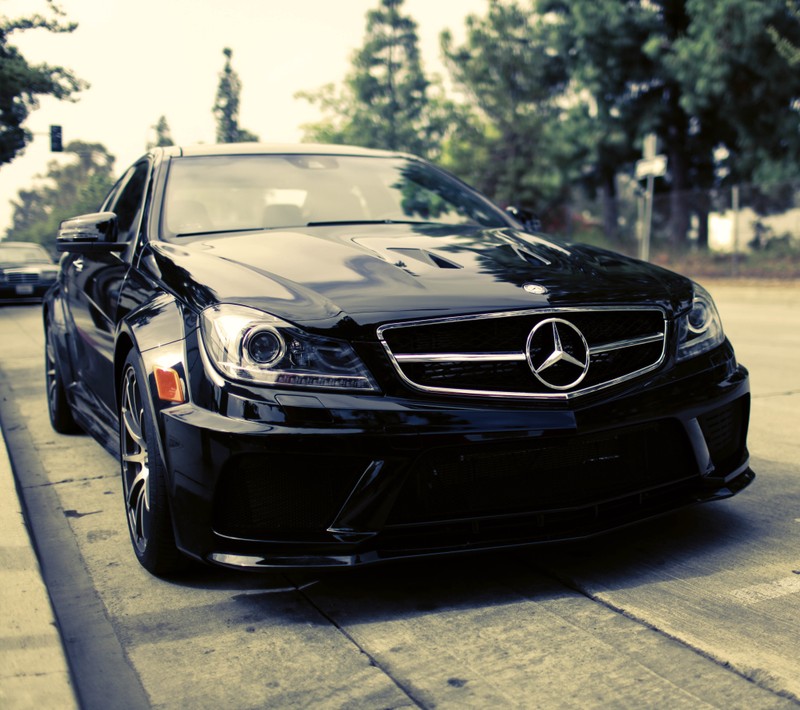 Arafed mercedes parked on the side of the road in front of a parking meter (auto, mercedes)