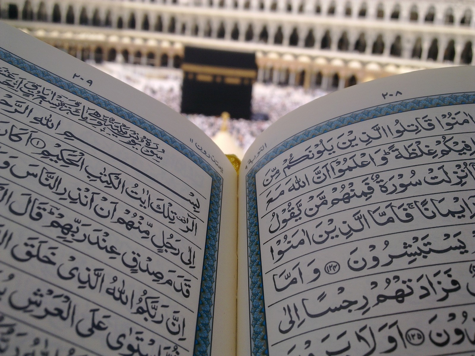 A close up of a book with arabic writing on it (house of allah, islam, islamic, kaaba, madina)