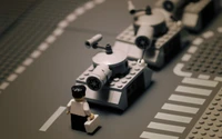 A LEGO figure approaches a line of gray LEGO tanks, set against a sleek, modern backdrop.