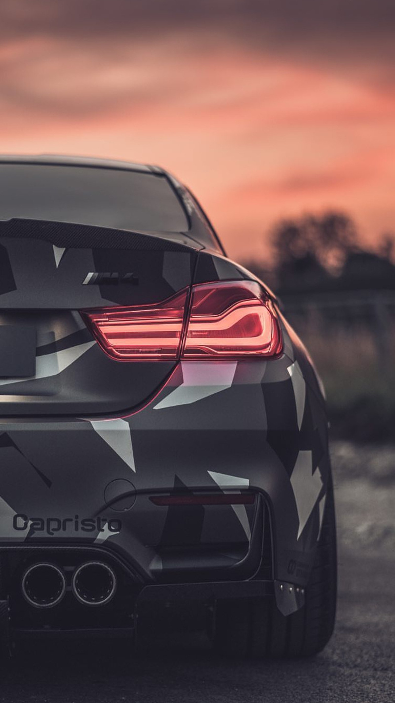 A close up of a car with a camouflage design on it (auto, bmw, car, coupe, f82)