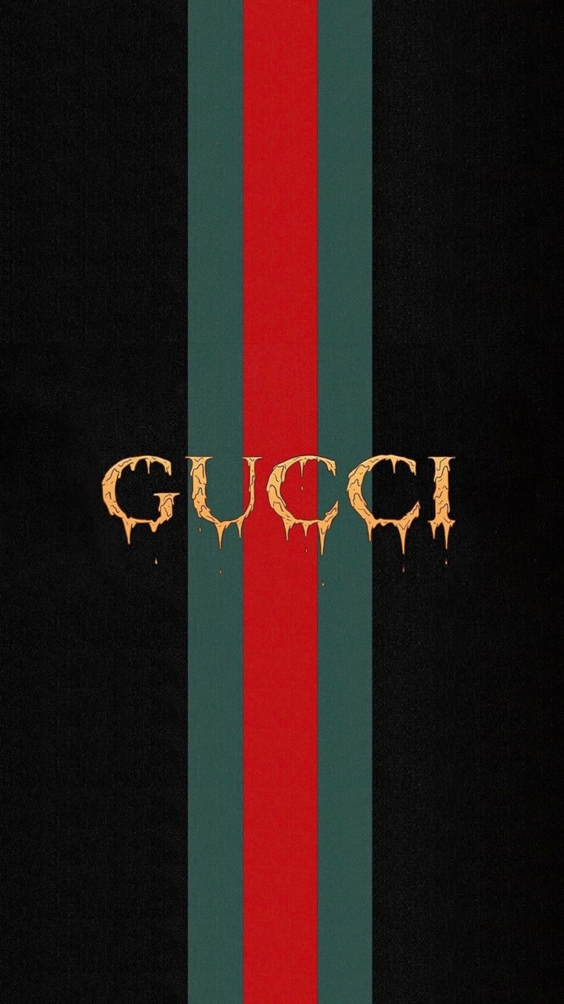 Близкий план красной и зеленой полосатой стены с золотым логотипом gucci (wpp)