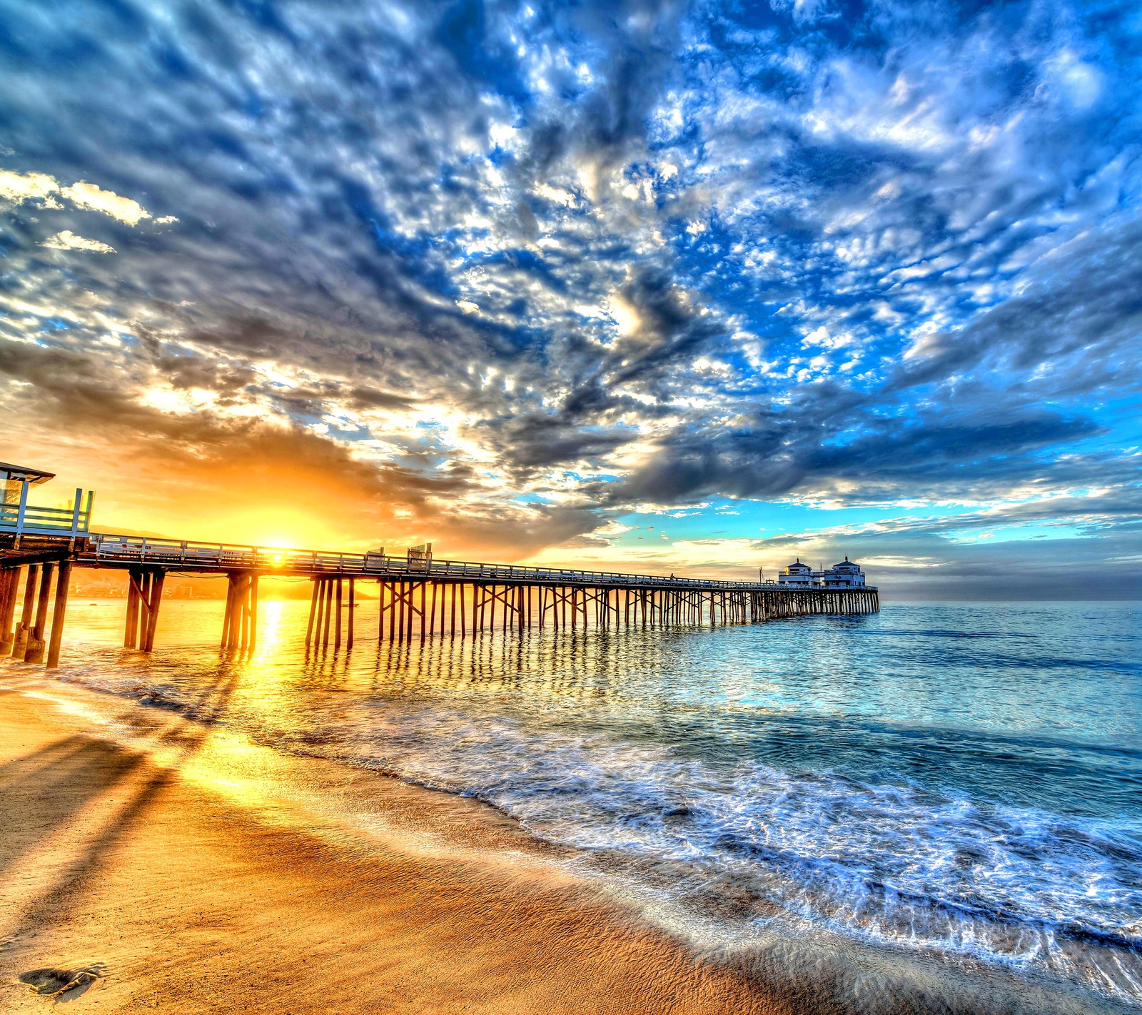 Arafed view of a pier with a pier and a sunset (beach, coast, ocean, sea, sunset)