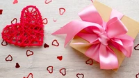 Cadeau de la Saint-Valentin avec décoration en forme de cœur et ruban rose