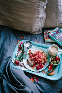 Delicious Strawberry Breakfast Spread on a Cozy Bed Tray