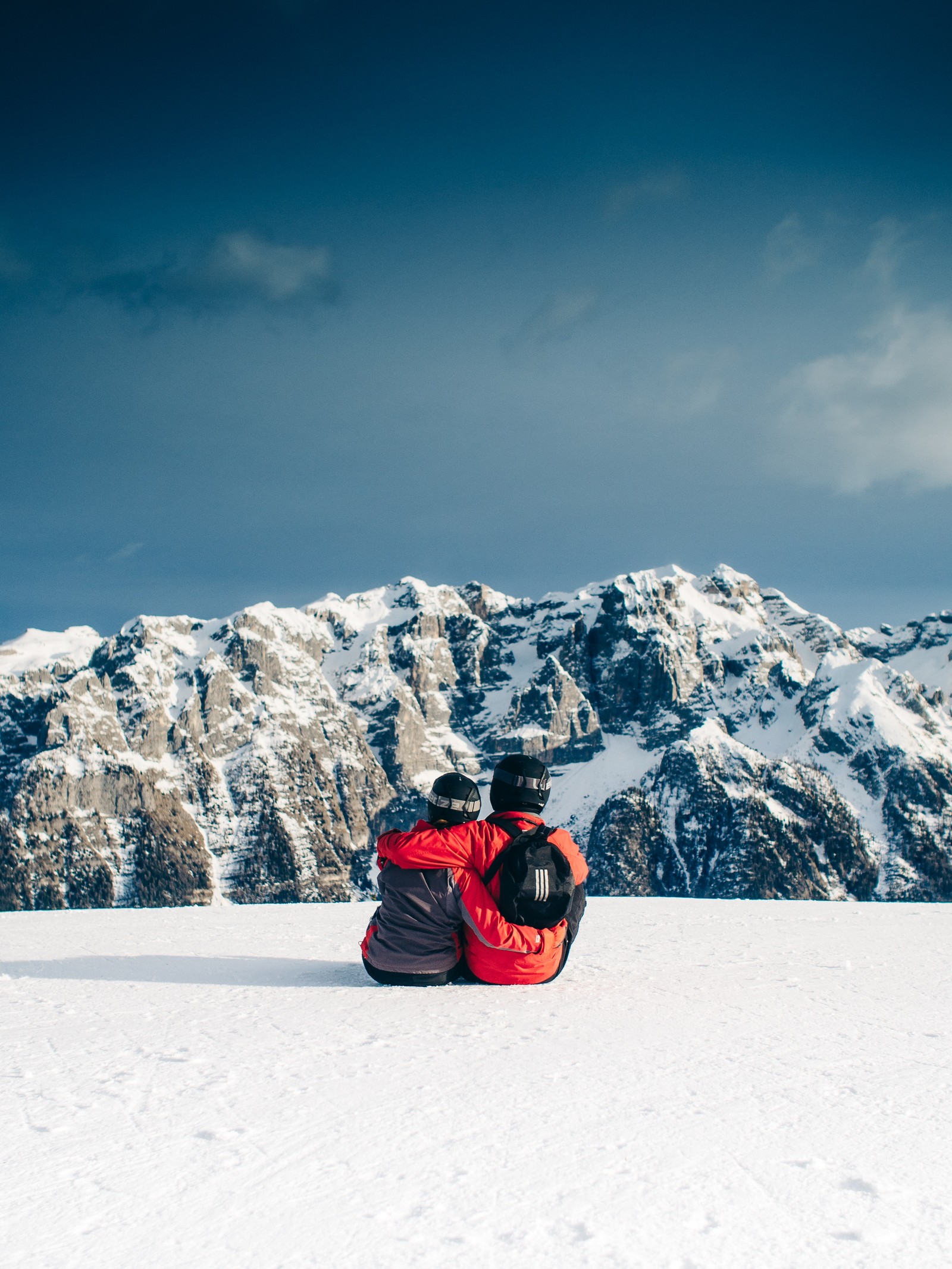 Skier sitting on the snow with his back to the camera (skiing, snow, mountainous landforms, mountain, winter)