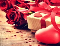 Elegant Gift Box Surrounded by Red Roses and Heart-Shaped Decorations