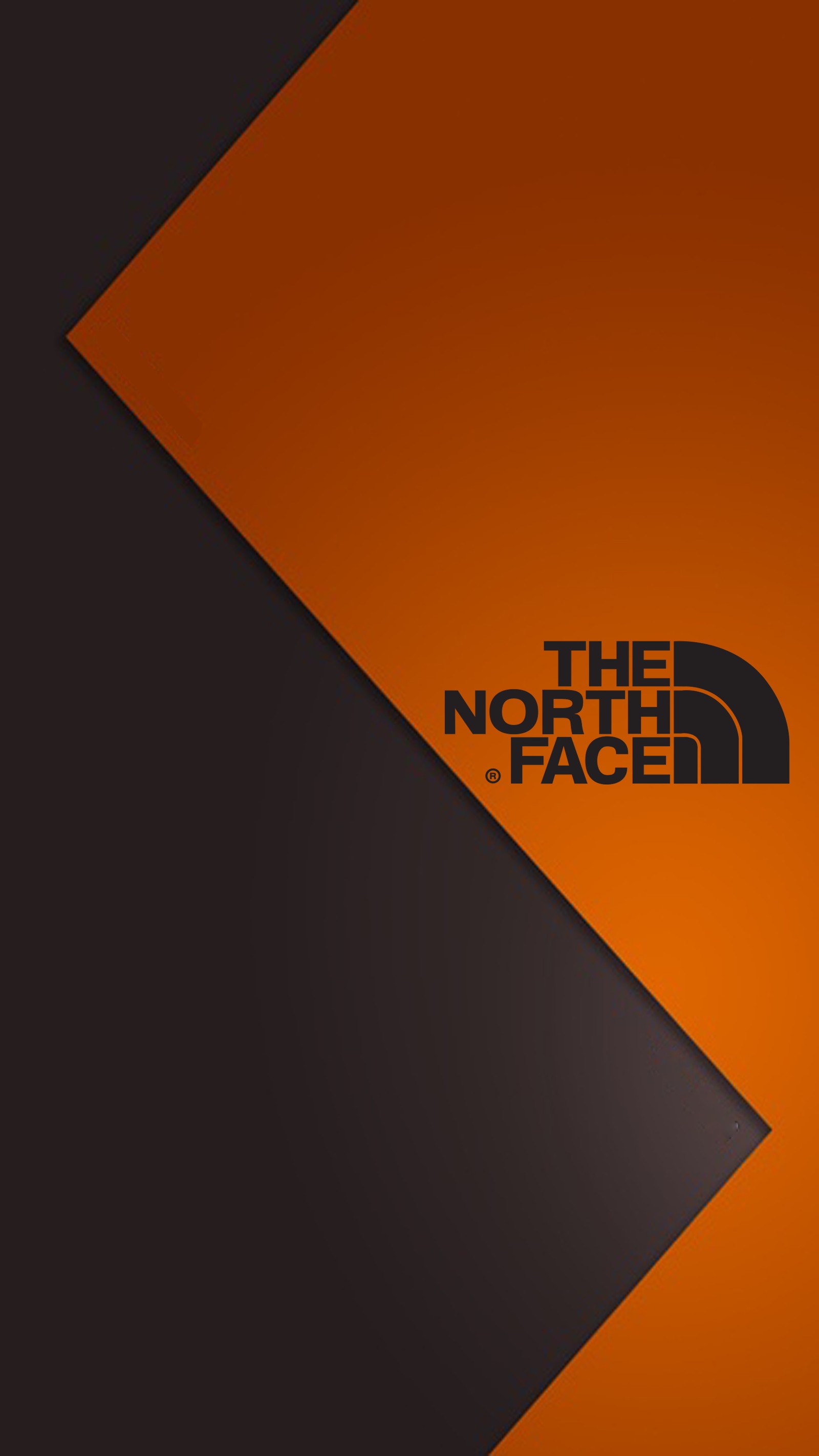 The north face logo on an orange and black background (929, abstract, brand, face, jacket)