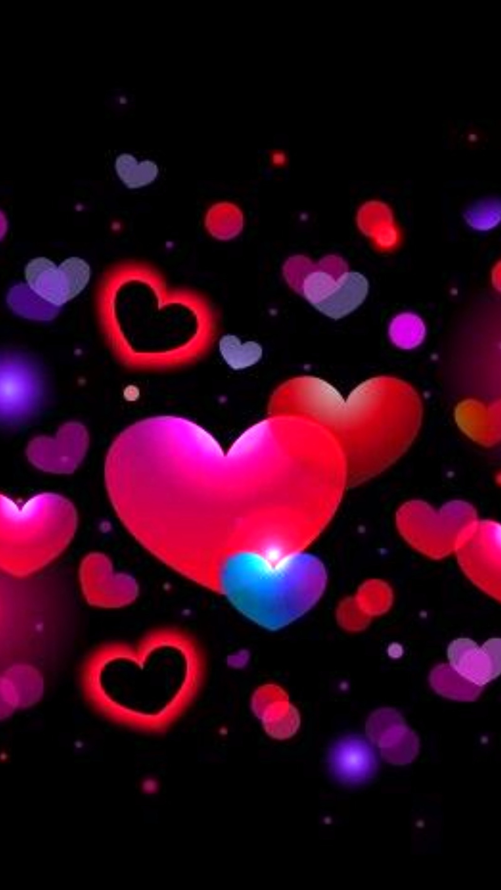 A group of hearts are glowing in the dark (blue, hearts, pink)