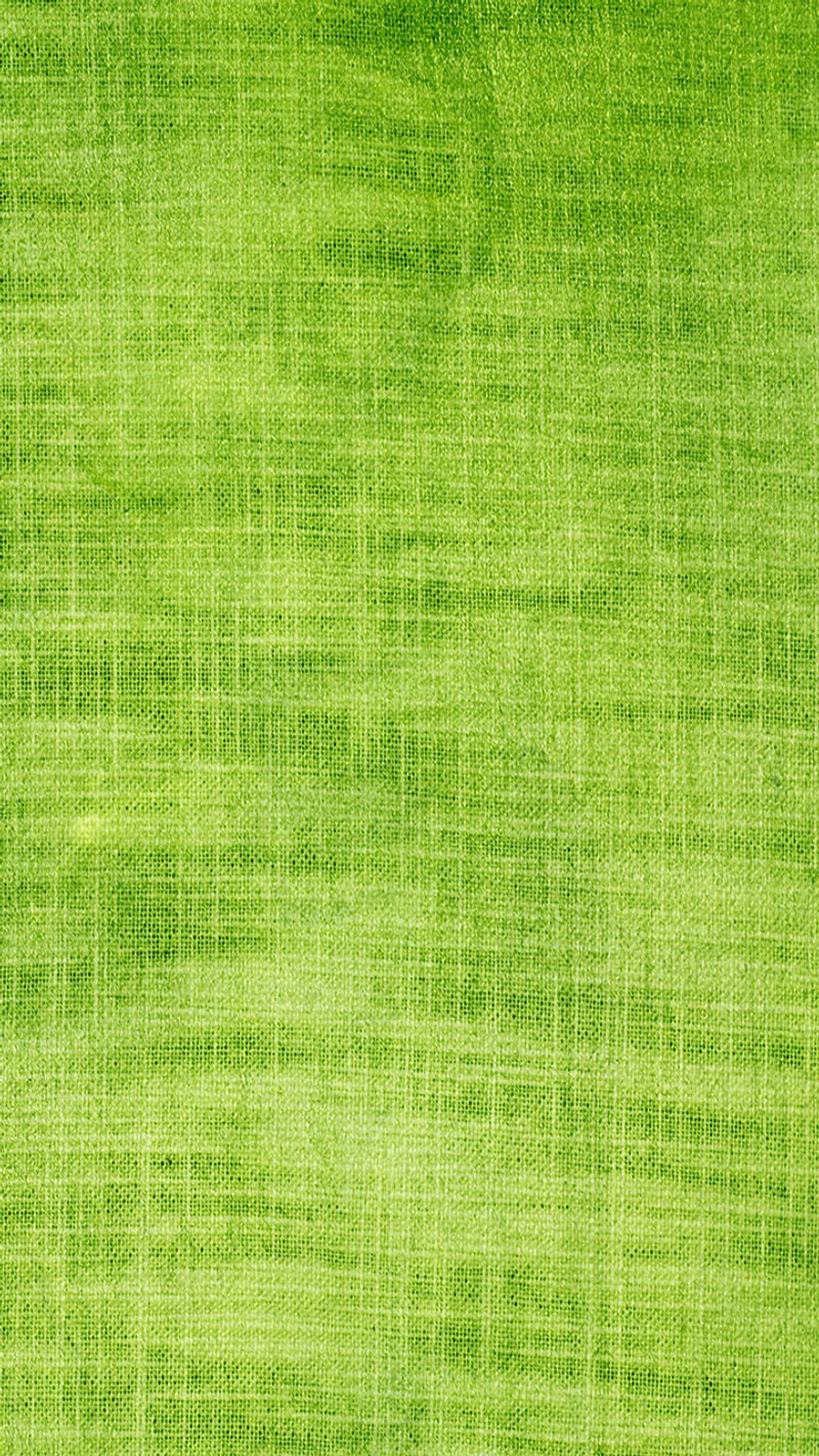 A close up of a green grass field with a single white bird (green, threads)