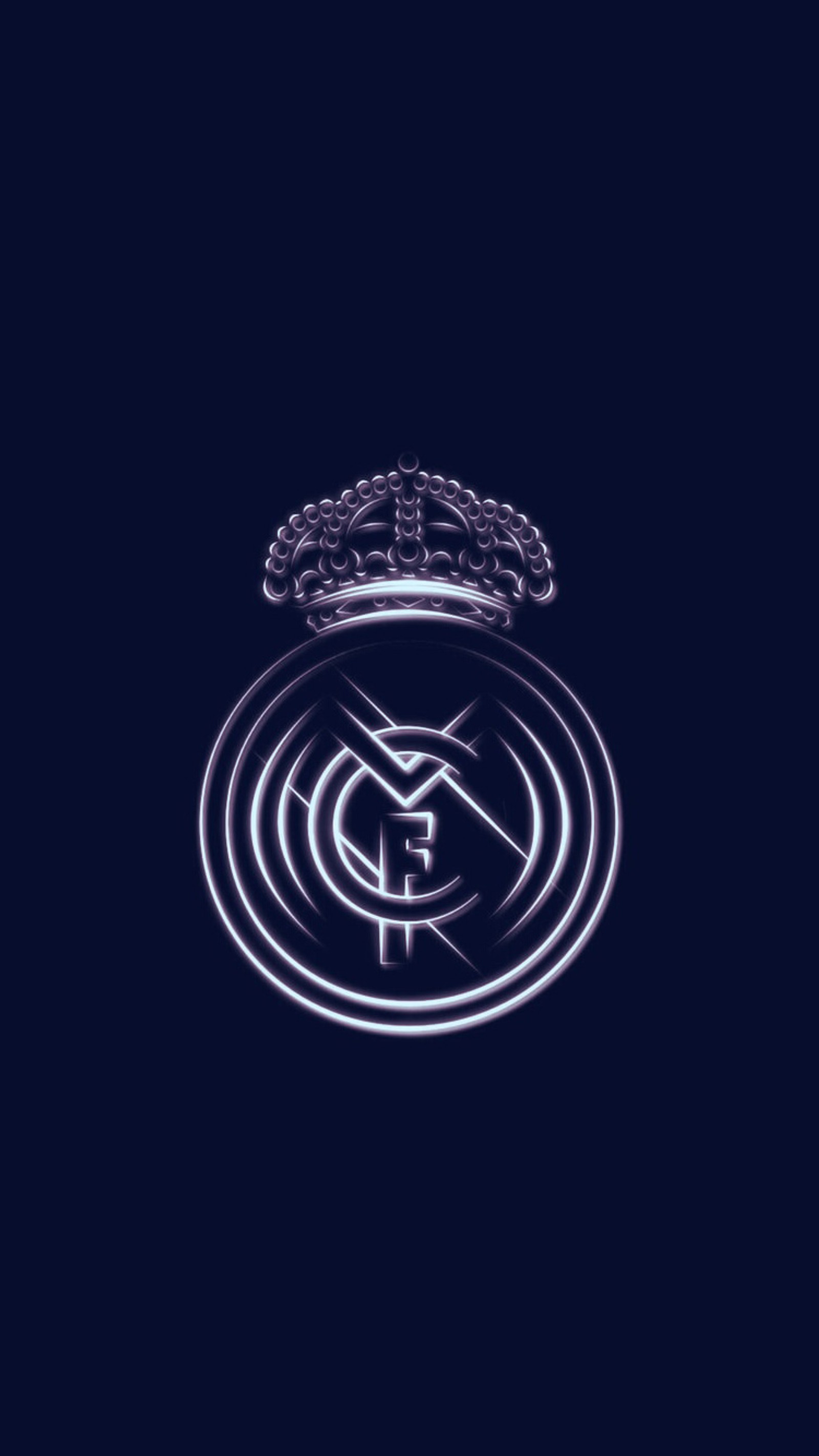 Um close de um logotipo em um fundo escuro (clube de futebol, logotipo, real madrid, esporte)