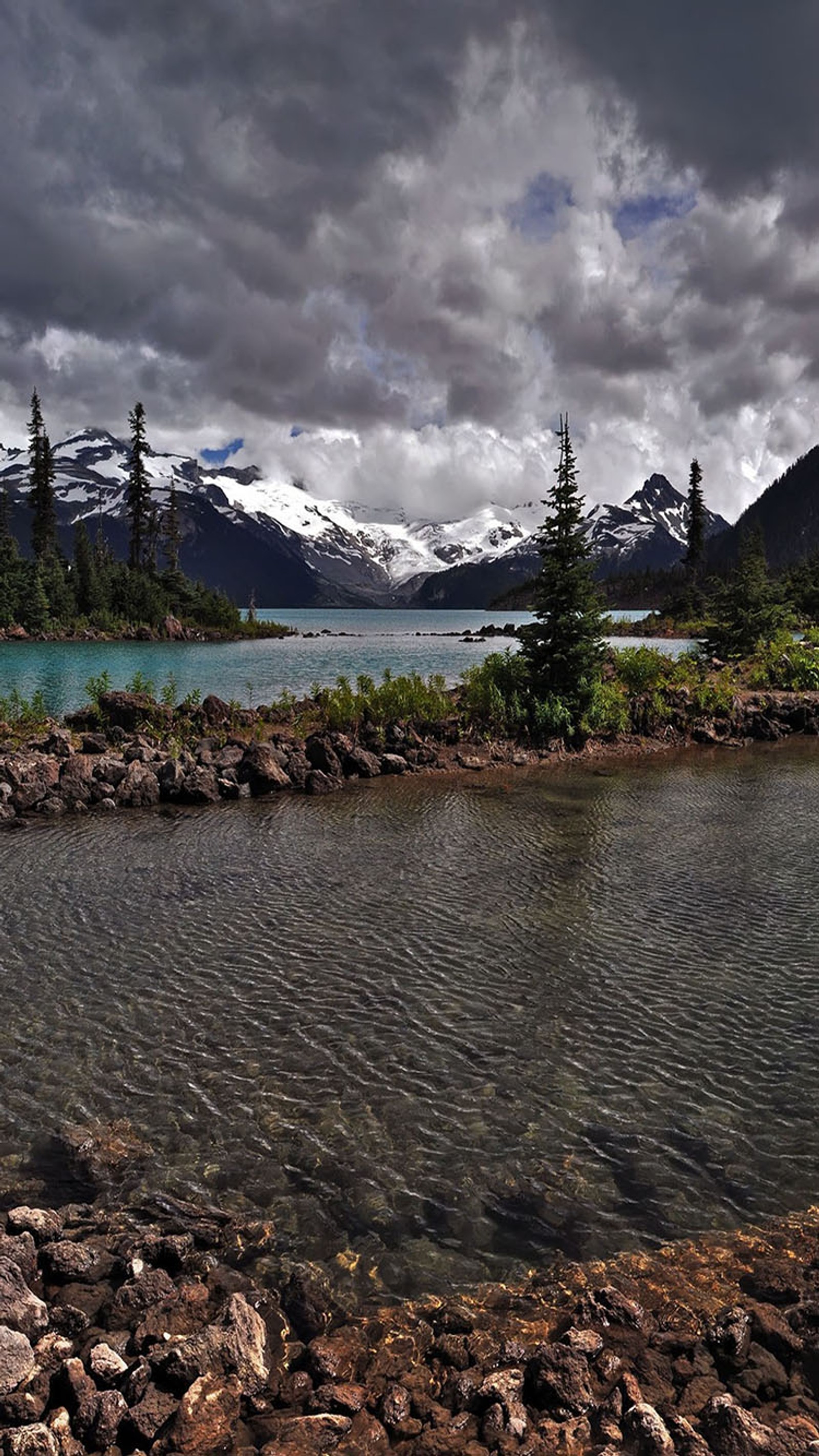 There is a lake with a mountain in the background (stream, water)