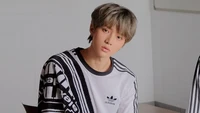 Choi Beomgyu from Tomorrow X Together in a casual Adidas outfit.